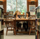 Two students at the library. 